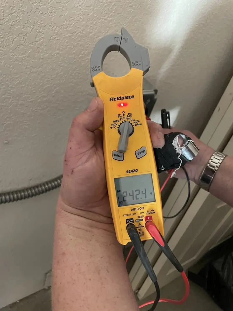 Voltage testing with clamp meter during Recessed Lighting Installation in Scott